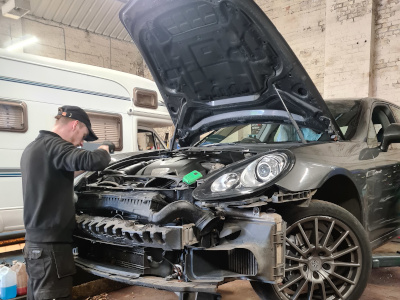 car mechanics repairing car